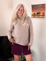 Ellen B poses in her ever short purple skirt